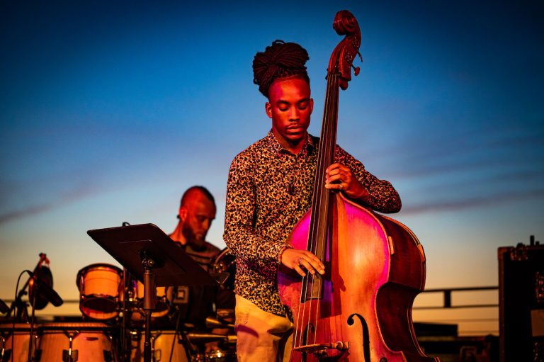 A man strums an oboe at the Madison Jazz Festival