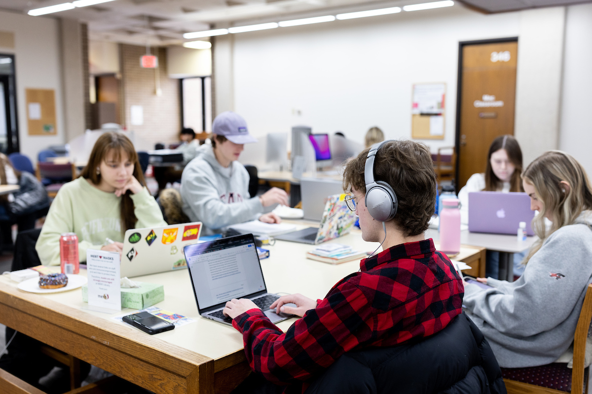 Students studying on laptops in the Library