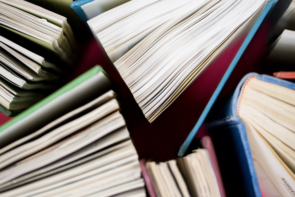 A number of books unfurled open