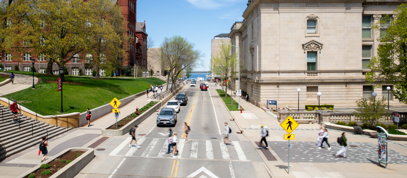 people walking across a street